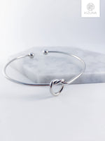 Load image into Gallery viewer, Twisted Bow Bangle
